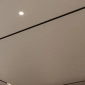Recessed false ceiling with black magnetic track lighting